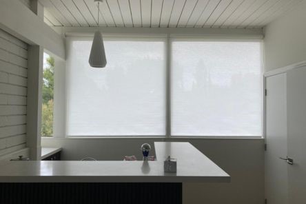 Close-up of roller shades installation in a Mission Viejo condo, highlighting the clean and functional design of custom window shades.